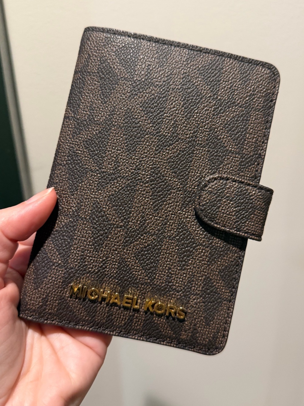 Michael Kors Dark Brown Monogram Passport Holder with Gold Logo